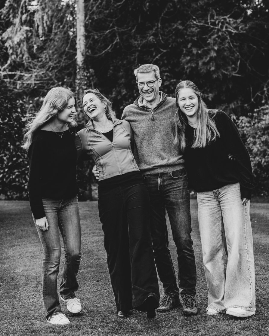 Candid photo of family laughing during 80th birthday celebration