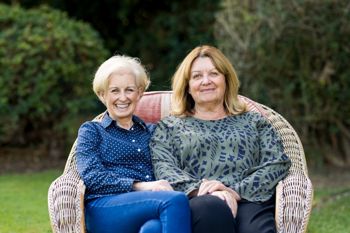 Sisters sat together.