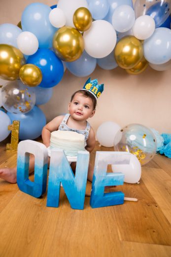 blue, gold and white theme cake smash