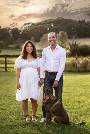 Maternity shoot during golden hour with partner and dog